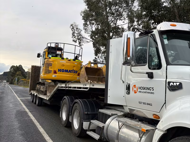 Hosking's truck and trailer transporting an excavator